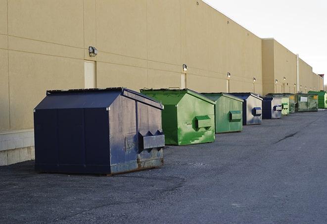 multiple dumpsters lining a construction site in Acworth